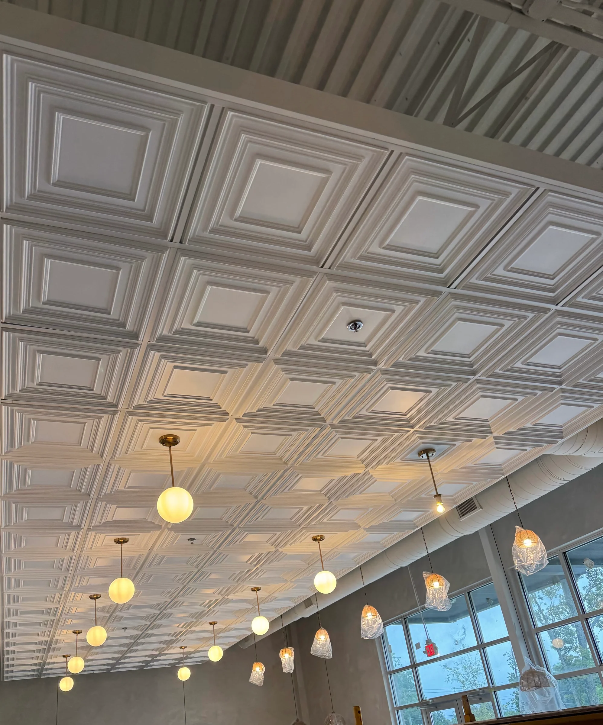 Decorative ceiling details above a commercial dining space