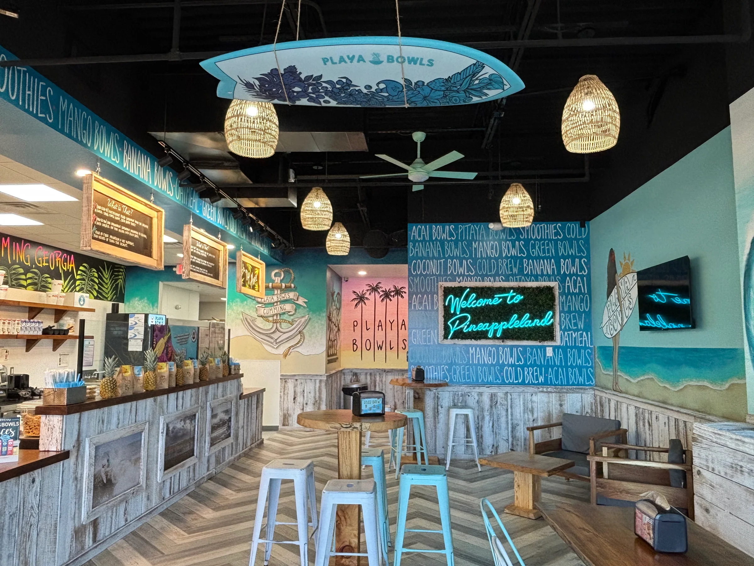 Restaurant interior with pendant lights, wall finishes, and built-in seating